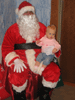 Sitting on Santa's lap at Daddy's work