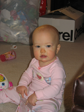 Sydney playing with her present