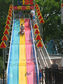 Going down the slide with Mommy