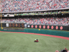 The Phillie Phanatic circling the field with Harry Kalas