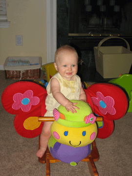 Enjoying her new butterfly toy