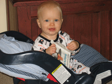 Sitting in her carseat