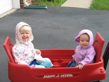 The girls getting a ride in the wagon
