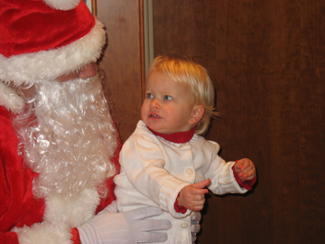 Explaining to Santa what she wants